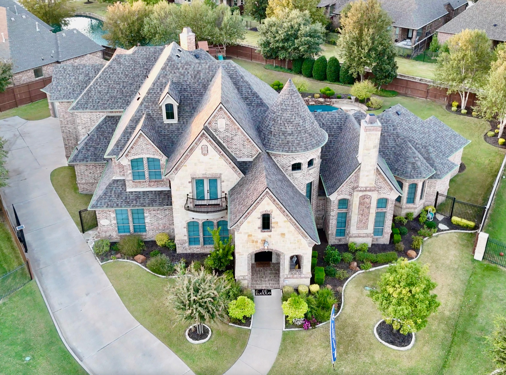 Aerial view of large luxury home roof
