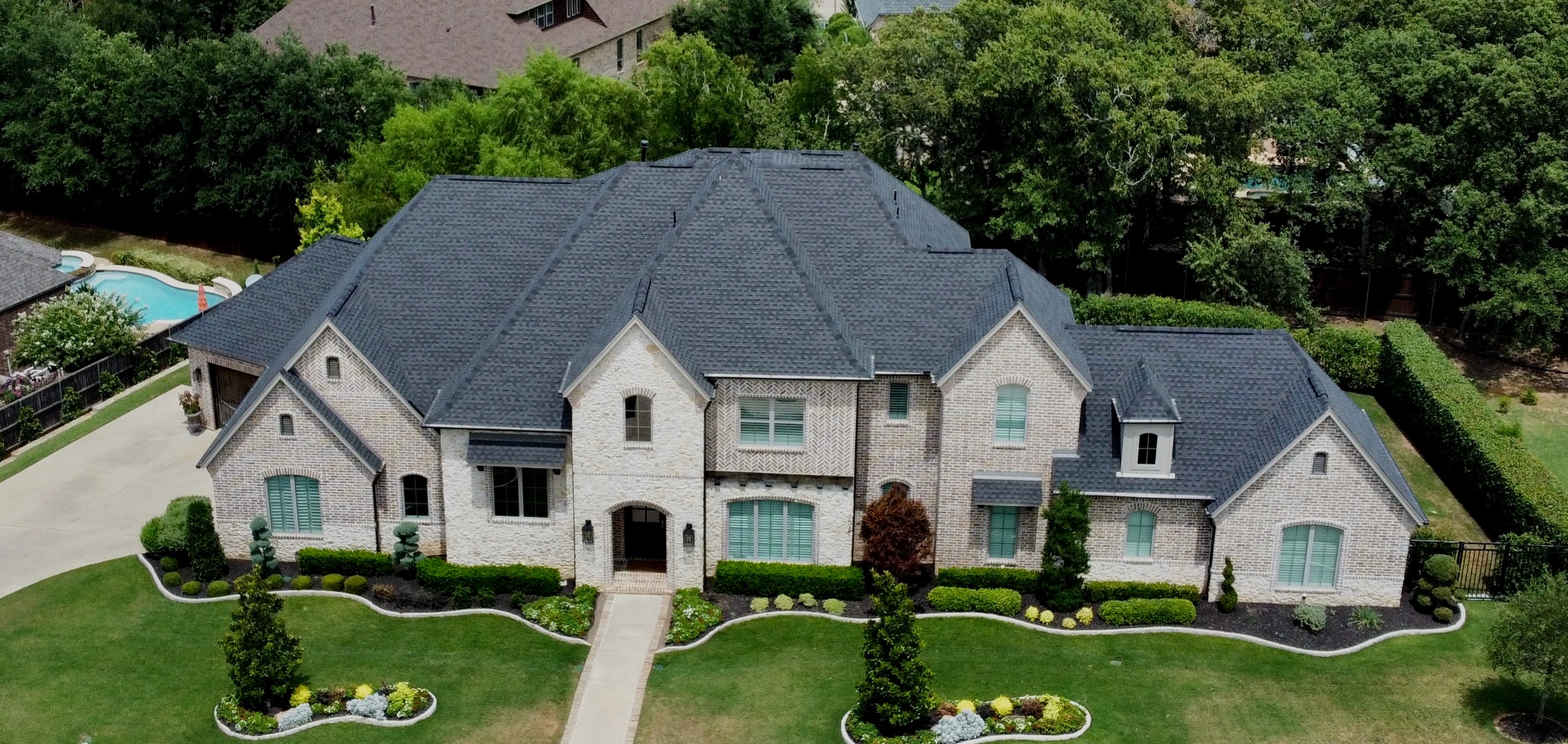 Completed shingle roof by Amity Roofing, aerial view